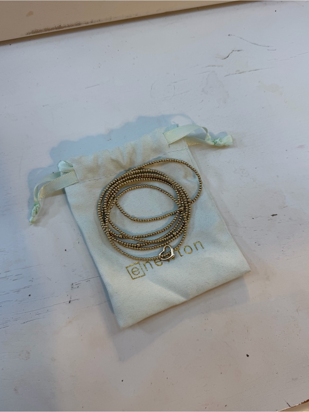 Gold-Tone Beaded Wrap Bracelet with Heart Accent by e.motion